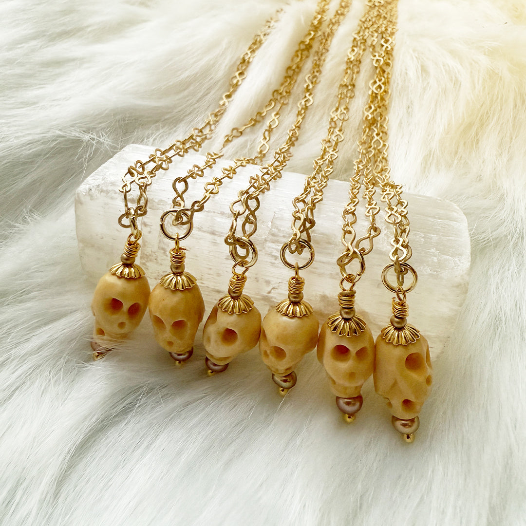 Carved Bone Skull with Pearl Necklace